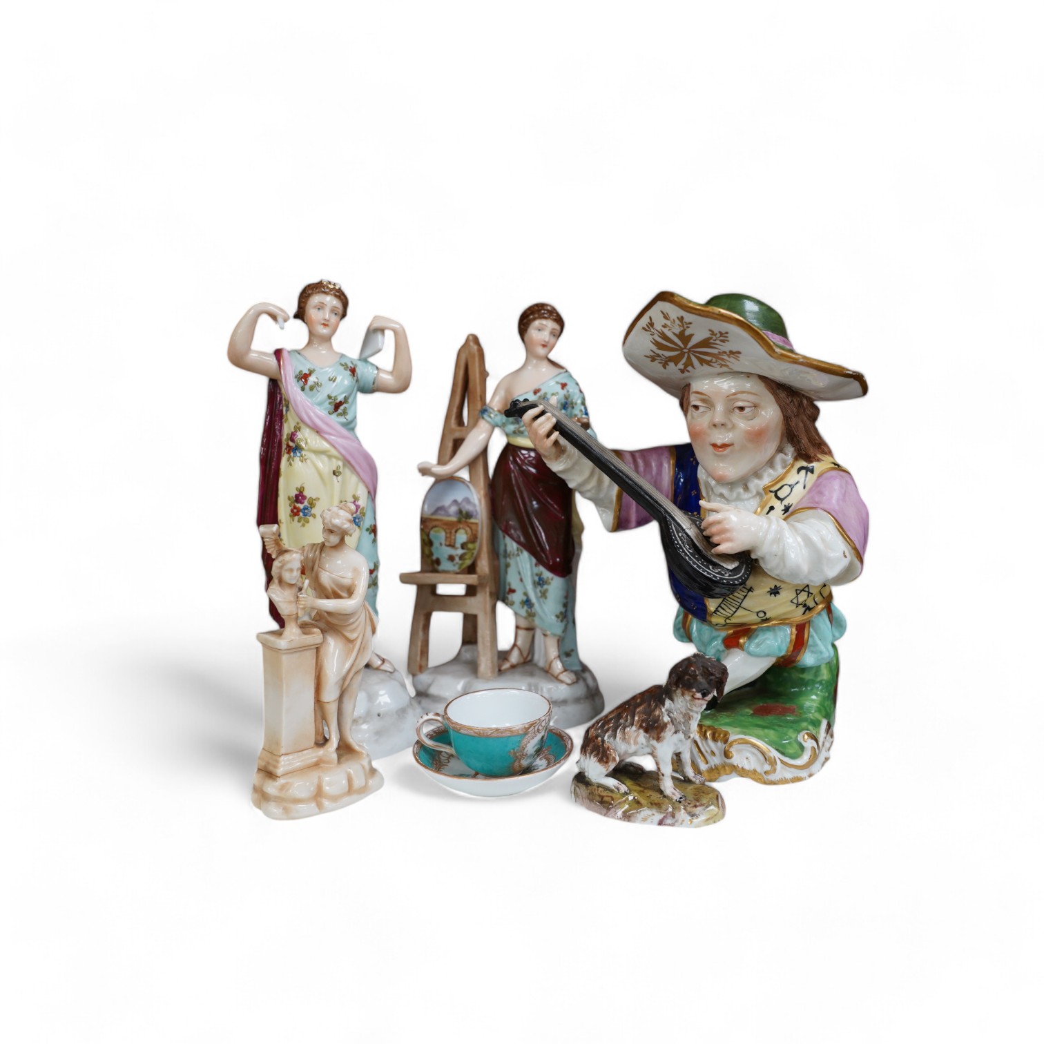 A 19th century French Mansion House Dwarf, a pair of Volkstedt figures, a Meissen dog, cup and saucer and a German porcelain female sculpture, tallest 21cm. Condition - fair to good, a few minor chips